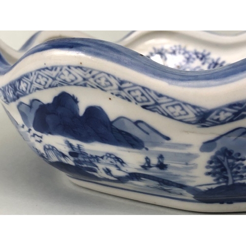 185 - Oriental ceramics, blue and white dish with fluted rim depicting a village landscape, unglazed base ... 