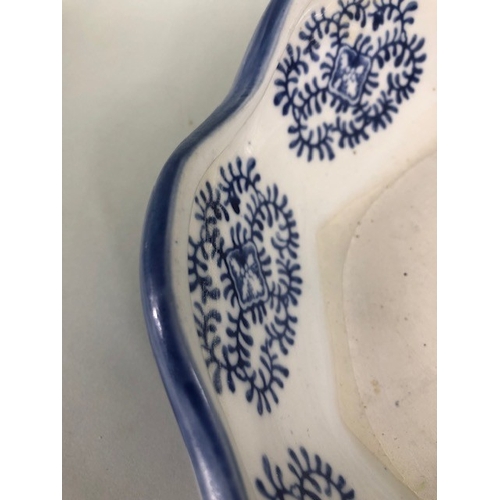 185 - Oriental ceramics, blue and white dish with fluted rim depicting a village landscape, unglazed base ... 