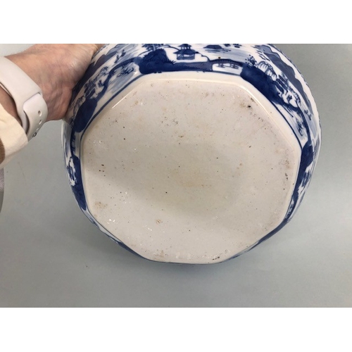 185 - Oriental ceramics, blue and white dish with fluted rim depicting a village landscape, unglazed base ... 