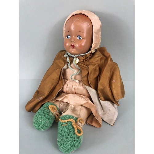 194 - Antique and Vintage dolls, 20th century doll with hand painted composition head, wearing a cloak, dr... 