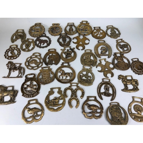 196 - Collection of Antique and vintage horse brasses to include Clock face, Ulster hand, Queens crown, ta... 