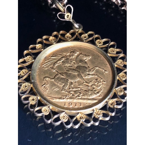 20 - Gold Sovereign dated 1911, in a fancy 9ct pendant mount of hearts, suspended from a 9ct gold belcher... 