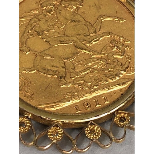 20 - Gold Sovereign dated 1911, in a fancy 9ct pendant mount of hearts, suspended from a 9ct gold belcher... 