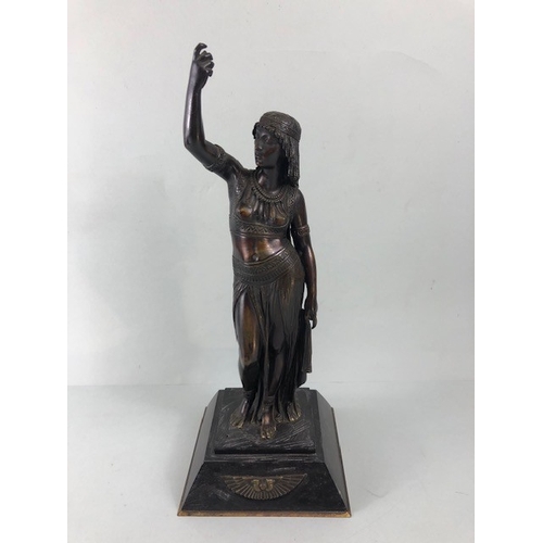 205 - Art Deco style patinated bronze figure of an Egyptian woman, stood on a stepped plinth with two head... 