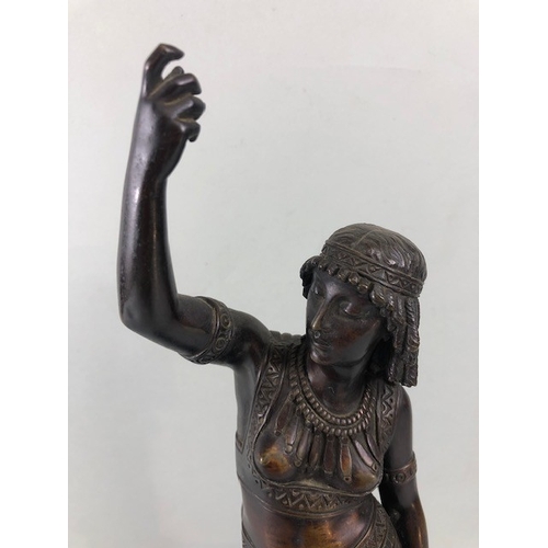 205 - Art Deco style patinated bronze figure of an Egyptian woman, stood on a stepped plinth with two head... 