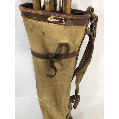 207 - Antique and vintage sporting equipment, set of golf clubs, woods, irons and putters in canvas bag