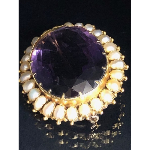 28 - Antique jewellery, 19th century brooch of oval cut Amethyst, approximately 20mm x 30mm, surrounded b... 