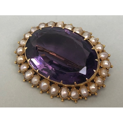 28 - Antique jewellery, 19th century brooch of oval cut Amethyst, approximately 20mm x 30mm, surrounded b... 