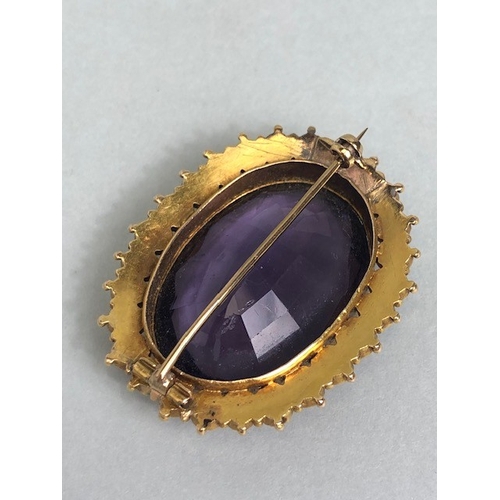 28 - Antique jewellery, 19th century brooch of oval cut Amethyst, approximately 20mm x 30mm, surrounded b... 