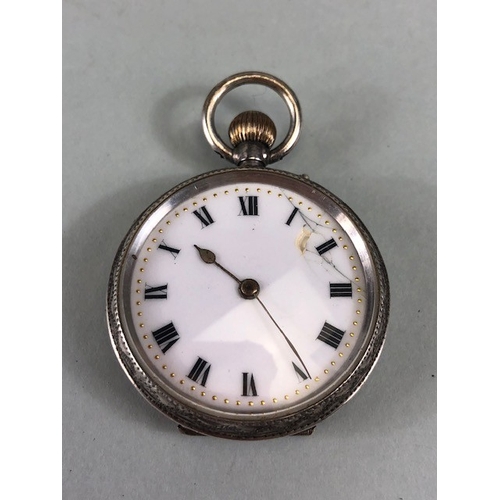 31 - Antique watches, two silver cased fob watches, the larger with roman numerals and flower design to d... 