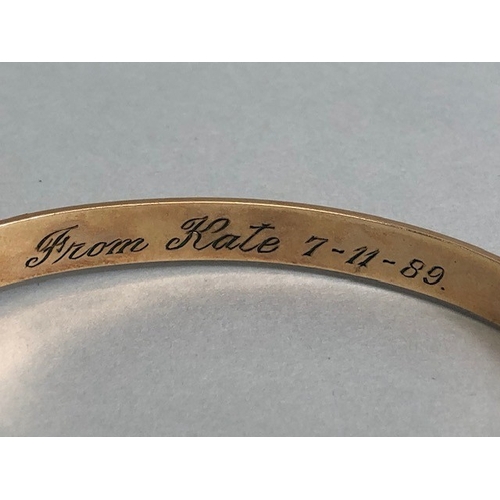 33 - Gold bangle marked 710 9ct, half plain half engraved design approximately 15.7g