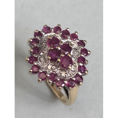 38 - 9ct gold quatrefoil cluster ring set with rubies and diamonds, in a white gold setting, approximatel... 