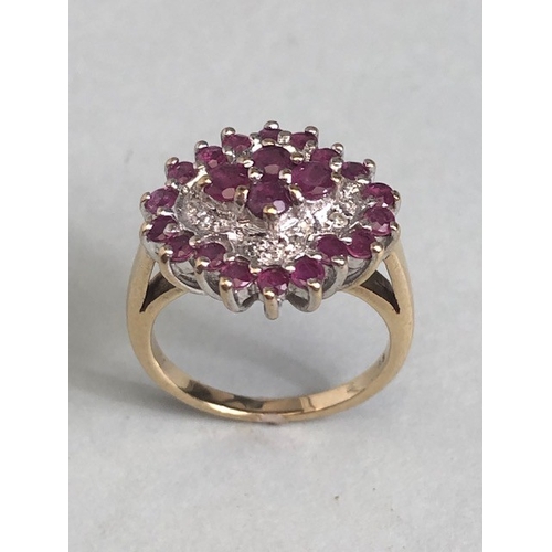 38 - 9ct gold quatrefoil cluster ring set with rubies and diamonds, in a white gold setting, approximatel... 