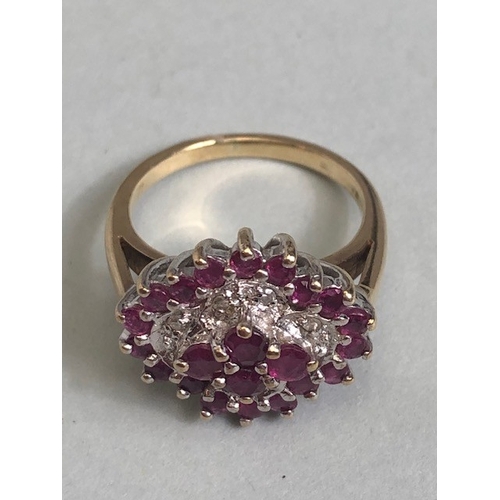 38 - 9ct gold quatrefoil cluster ring set with rubies and diamonds, in a white gold setting, approximatel... 