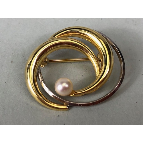 41 - Vintage 9ct marked swirl brooch set with a seed pearl approximately 2.03g and a pair of stone set ea... 