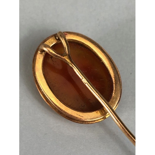 48 - Antique jewellery, 19th century rose metal mounted cameo stick pin, approximately 3.28g