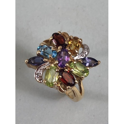 53 - Cocktail cluster ring of multi colour stones, the shank marked 9k and 375 approximately size J and 3... 