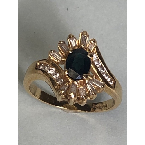 55 - 14kt marked gold cocktail ring, oval central sapphire surrounded by 10 baguette diamonds 10 round cu... 