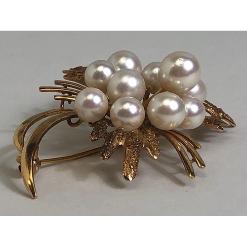 17 - 14ct Gold and pearl floral spray brooch with ten raised pearls and texture to some gold petals appro... 