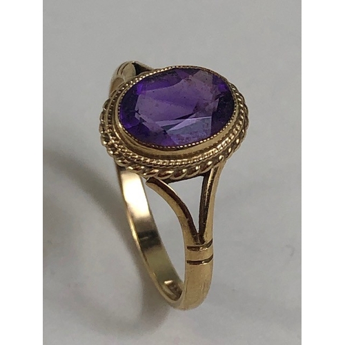 32 - Vintage 9ct Gold ring set with a purple Amethyst Oval cut and faceted approx size L