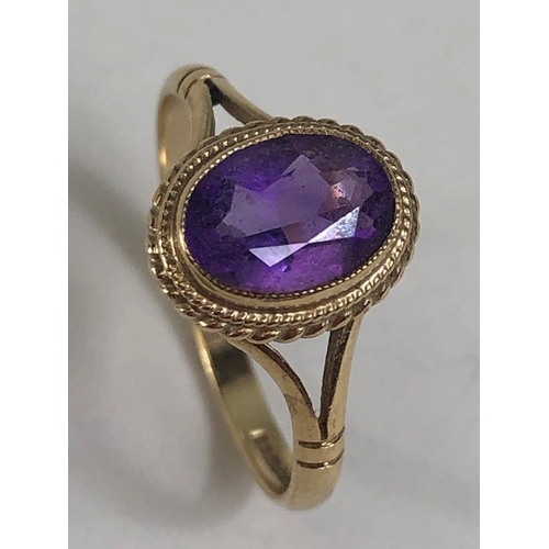 32 - Vintage 9ct Gold ring set with a purple Amethyst Oval cut and faceted approx size L