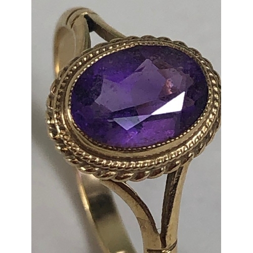 32 - Vintage 9ct Gold ring set with a purple Amethyst Oval cut and faceted approx size L