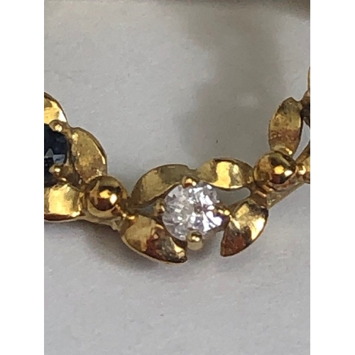 7 - 9ct Gold wreath design oval brooch set with white and blue gemstones approx 2.6cm tall and 1.7g