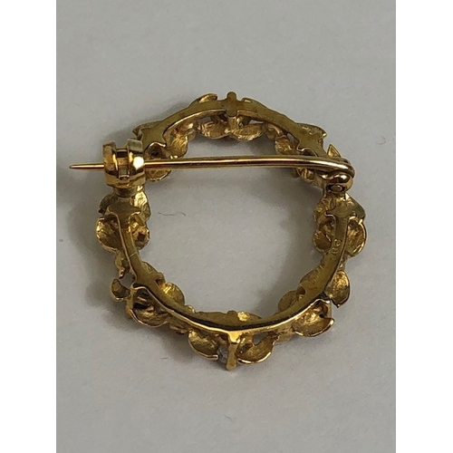 7 - 9ct Gold wreath design oval brooch set with white and blue gemstones approx 2.6cm tall and 1.7g