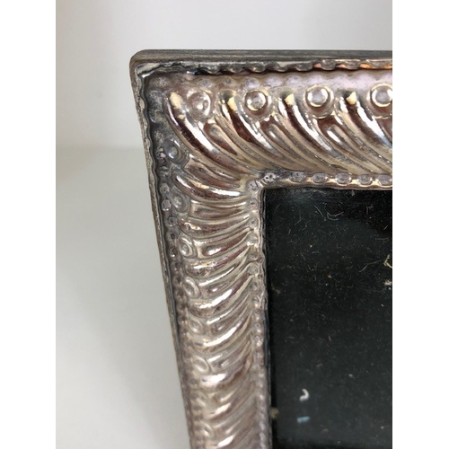 82 - Antique and vintage silver, two photo frames mounted in hallmarked silver, one with floral decoratio... 
