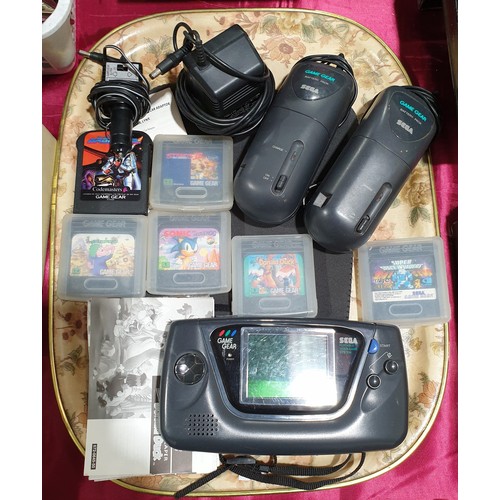 42 - A Sega Game Gear video game console with accessories and 6 games.