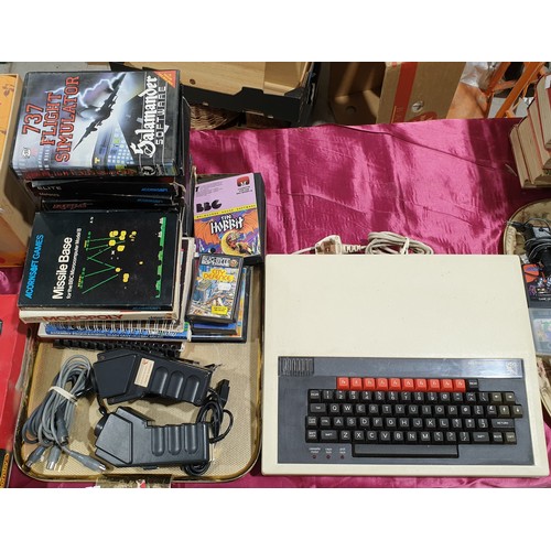 43 - A vintage BBC Acorn computer with games, ephemera and accessories.