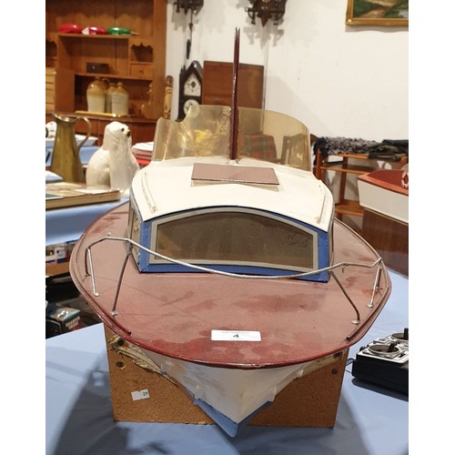 4 - A remote control boat with a controller, length 49