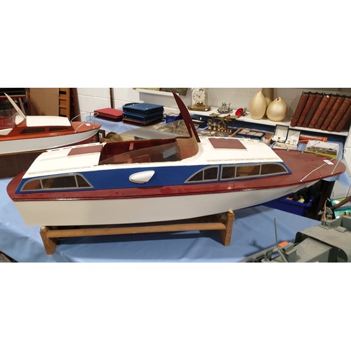 4 - A remote control boat with a controller, length 49