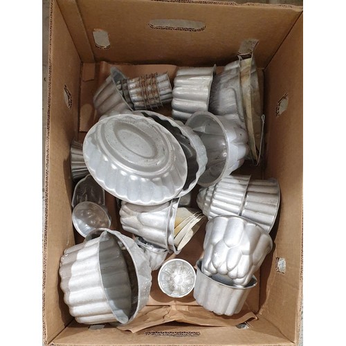 10 - A box of vintage aluminium food moulds.