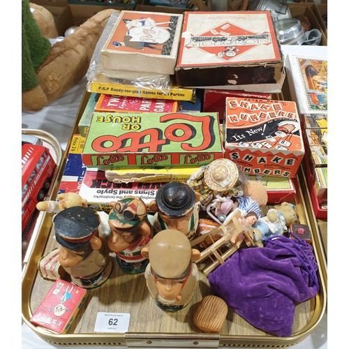 62 - A tray of vintage games and PG Tips egg cup holders.