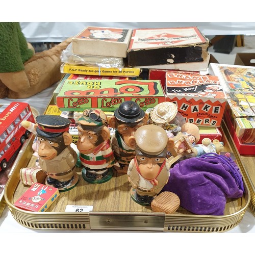 62 - A tray of vintage games and PG Tips egg cup holders.