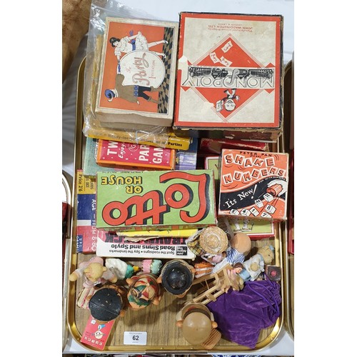 62 - A tray of vintage games and PG Tips egg cup holders.