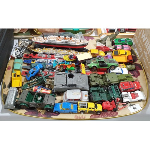 65 - A selection of toy vehicles.