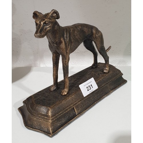 231 - A cast iron model of a grey hound, height 7.75