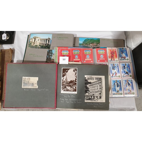 251 - Two postcard albums and an album of football cards.