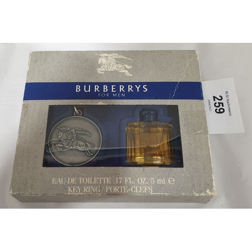 259 - A vintage boxed Burbery keyring and l'eau de toilette gift set.