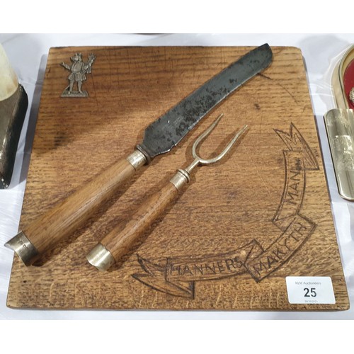 25 - An oak chopping board with silver hallmarked boar figure motif together with a carving knife and for... 