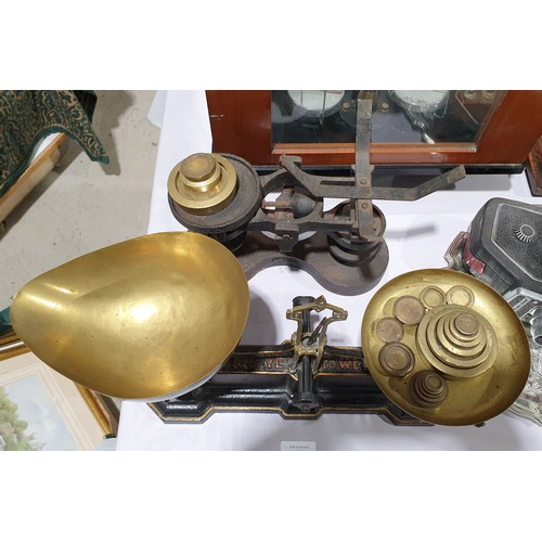 18 - A pair of antique cast iron Avery scales and one other together with weights.