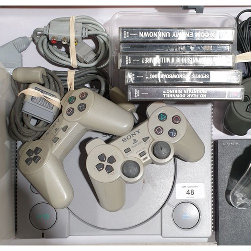 48 - A Sony Playstation 1 with games and two controllers.

UK shipping only, £14.
