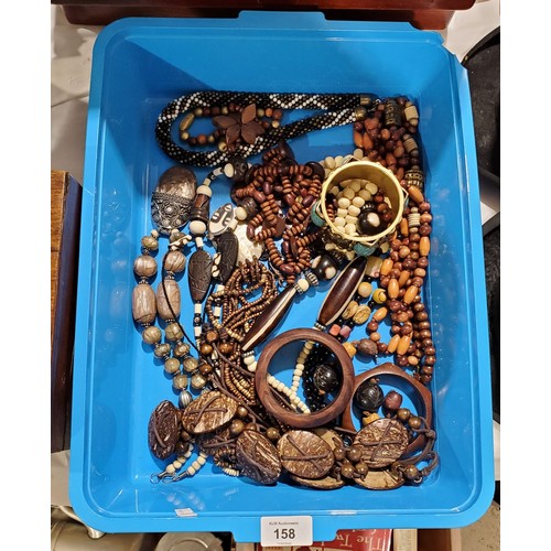 158 - A tray of wood and tribal jewellery.

UK shipping only, £14.