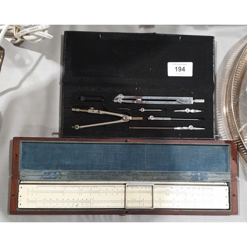 194 - A compass set and slide rule in a mahogany case.

UK shipping £14.