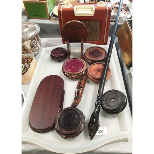 203 - A hard wood stand and a walking stick with a carved tribal head. No shipping. Arrange collection or ... 