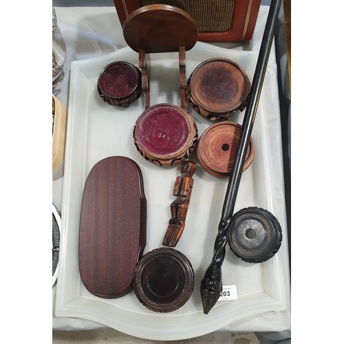 203 - A hard wood stand and a walking stick with a carved tribal head. No shipping. Arrange collection or ... 