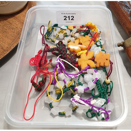 212 - Fifteen jade bead pendants and bracelets.

UK shipping £14.