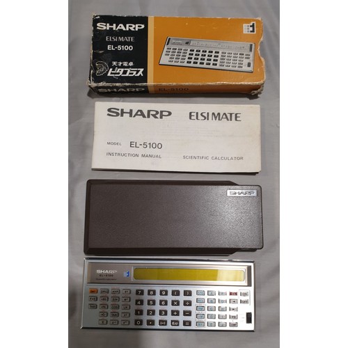 215 - A vintage Sharp Elsimate EL-5100 scientific calculator with original box and instructions.

UK shipp... 